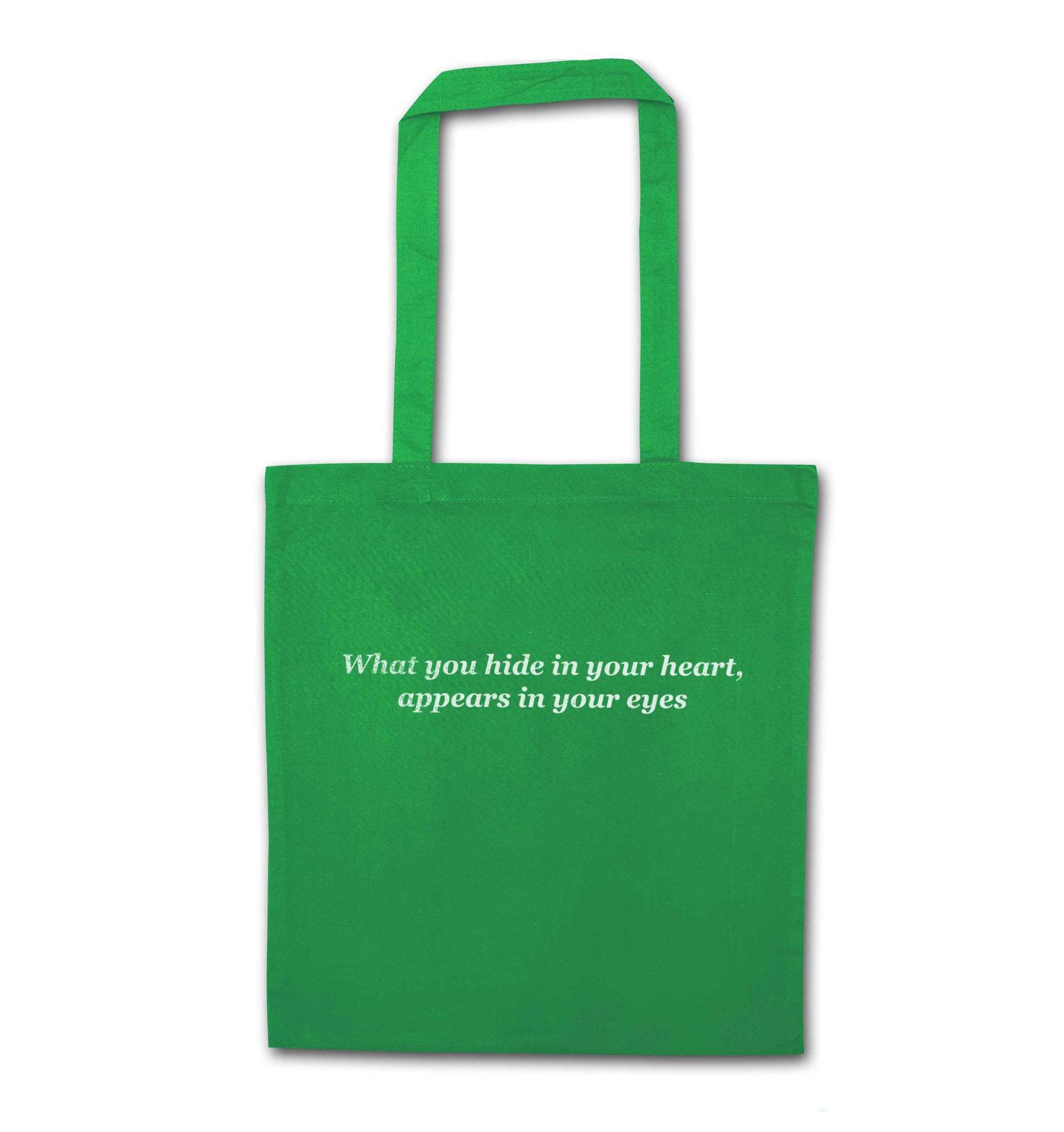What you hide in your heart, appears in your eyes green tote bag
