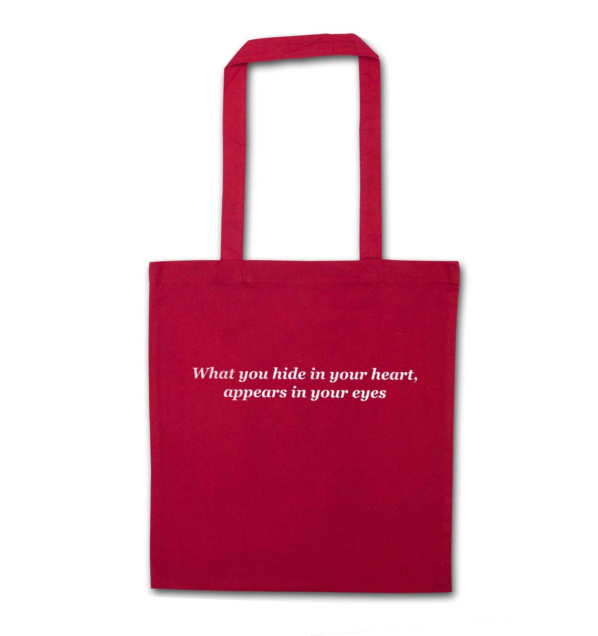 What you hide in your heart, appears in your eyes red tote bag