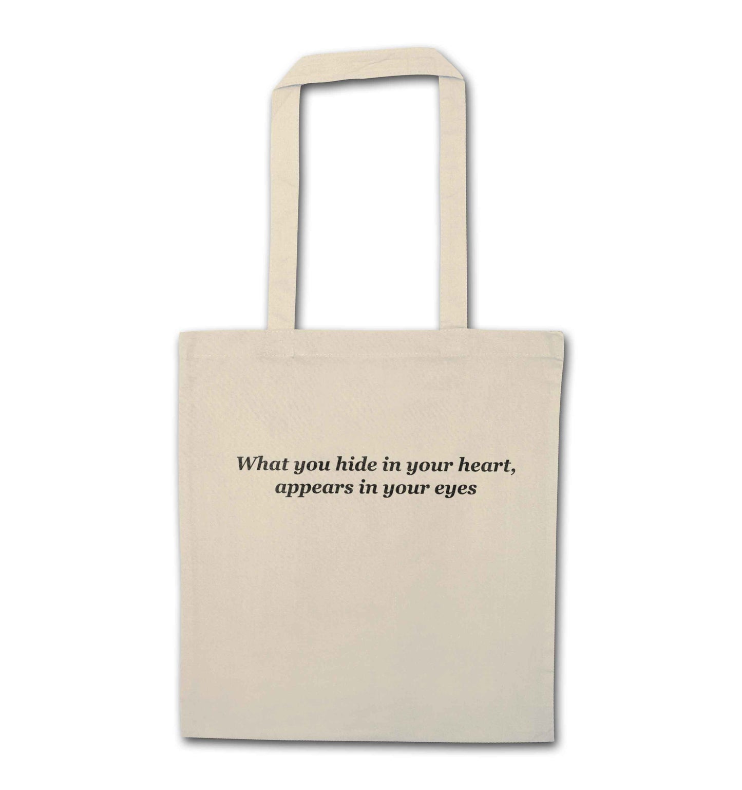 What you hide in your heart, appears in your eyes natural tote bag