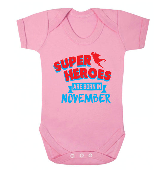 Superheroes are born in November Baby Vest pale pink 18-24 months