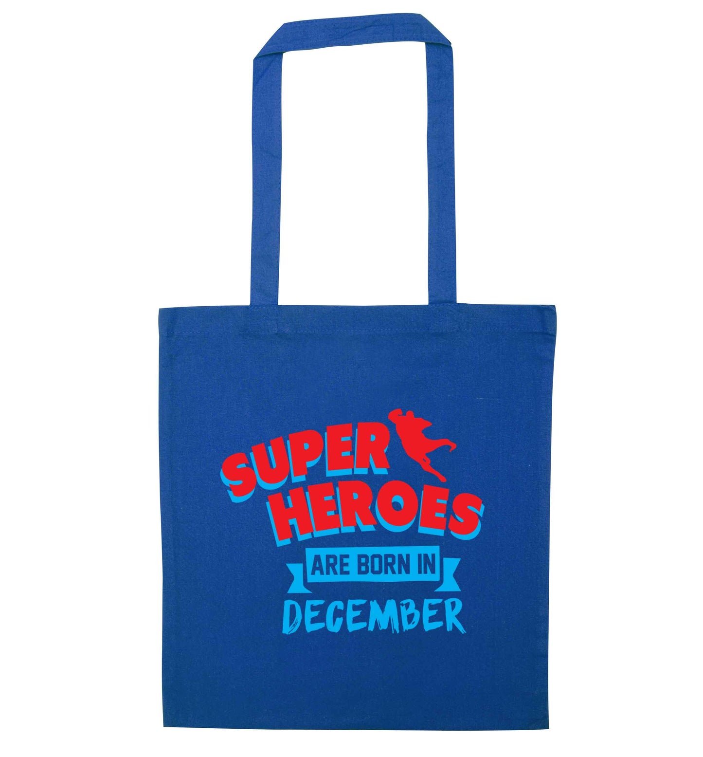 Superheroes are born in December blue tote bag