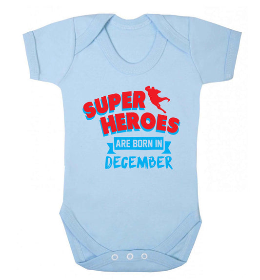 Superheroes are born in December Baby Vest pale blue 18-24 months