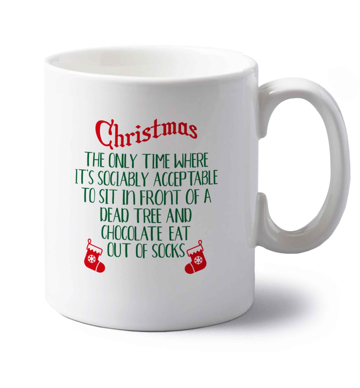 Christmas sit in front of a dead tree and eat chocolate out of socks left handed white ceramic mug