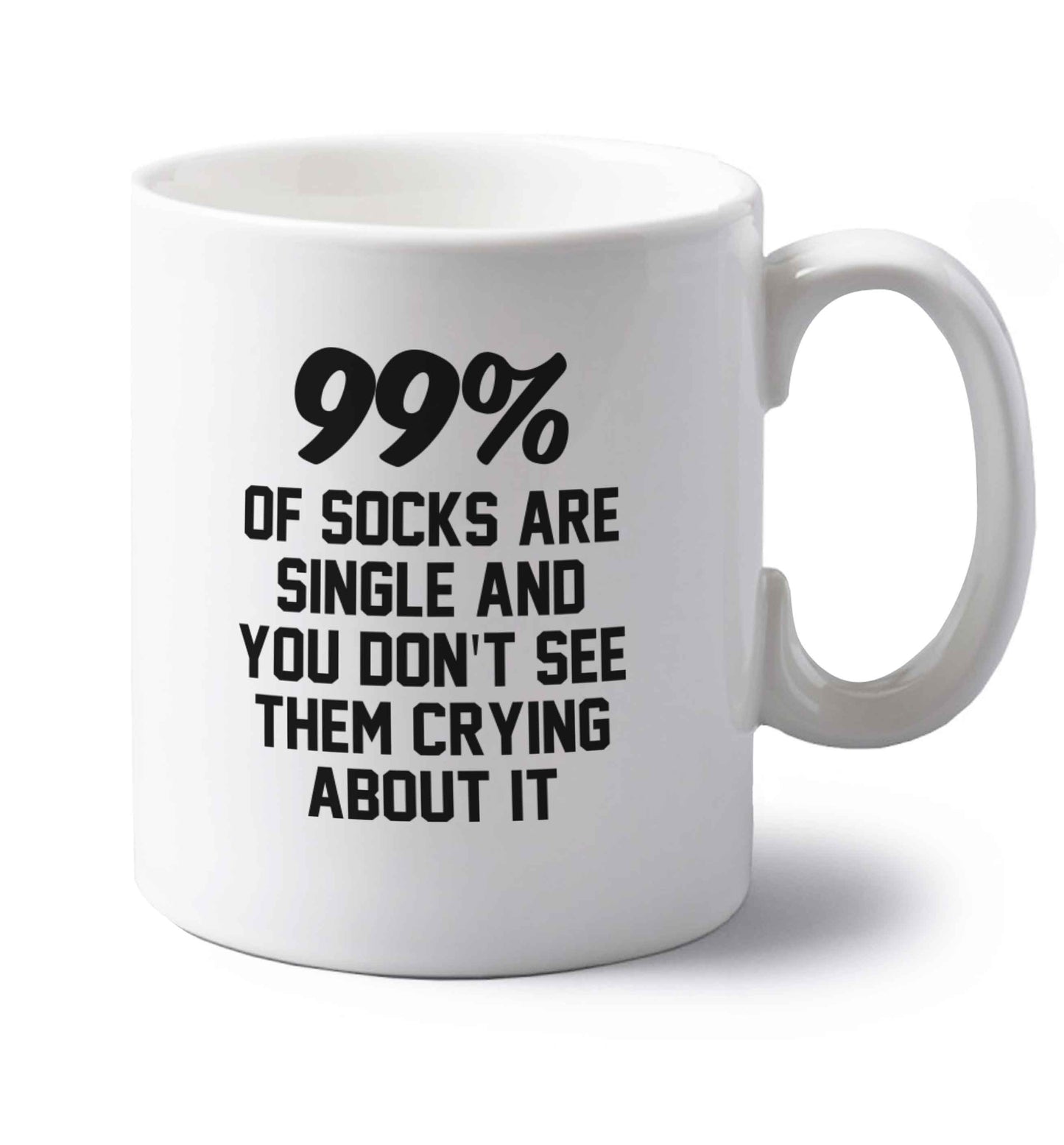 99% of socks are single and you don't see them crying about it left handed white ceramic mug