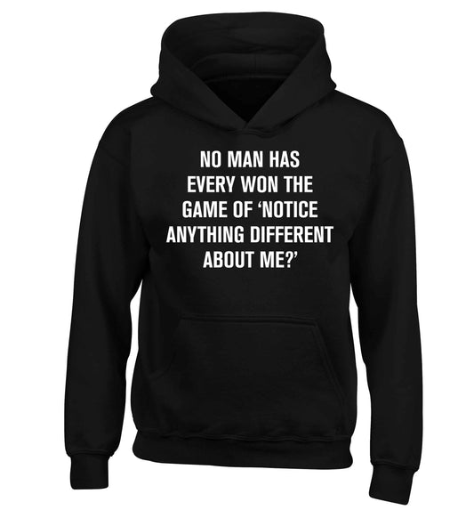 No man has ever won the game of 'notice anything different about me?' children's black hoodie 12-13 Years