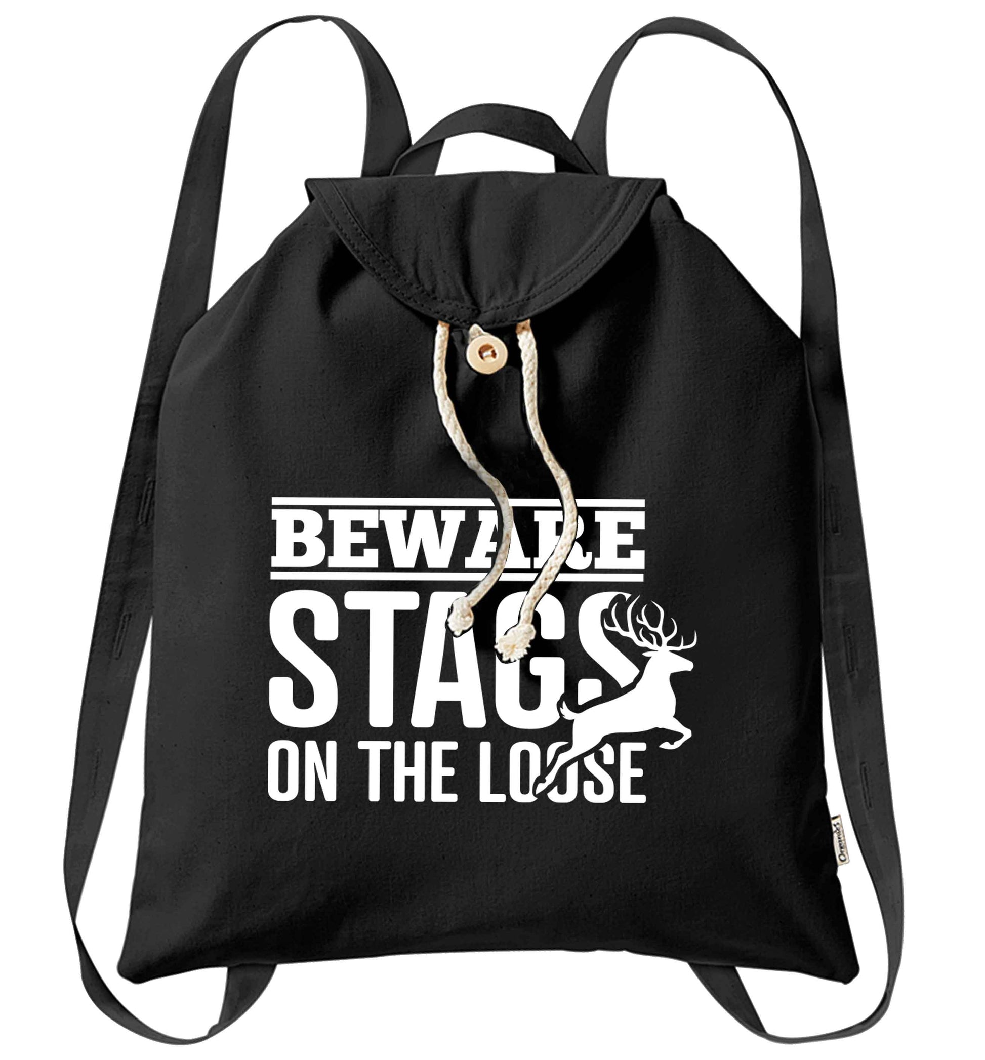 Beware stags on the loose organic cotton backpack tote with wooden buttons in black