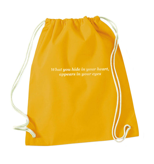 What you hide in your heart, appears in your eyes mustard drawstring bag