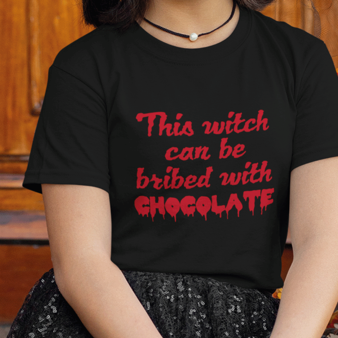 children's black T-Shirt with red text on reading this witch can be bribed with chocolate 