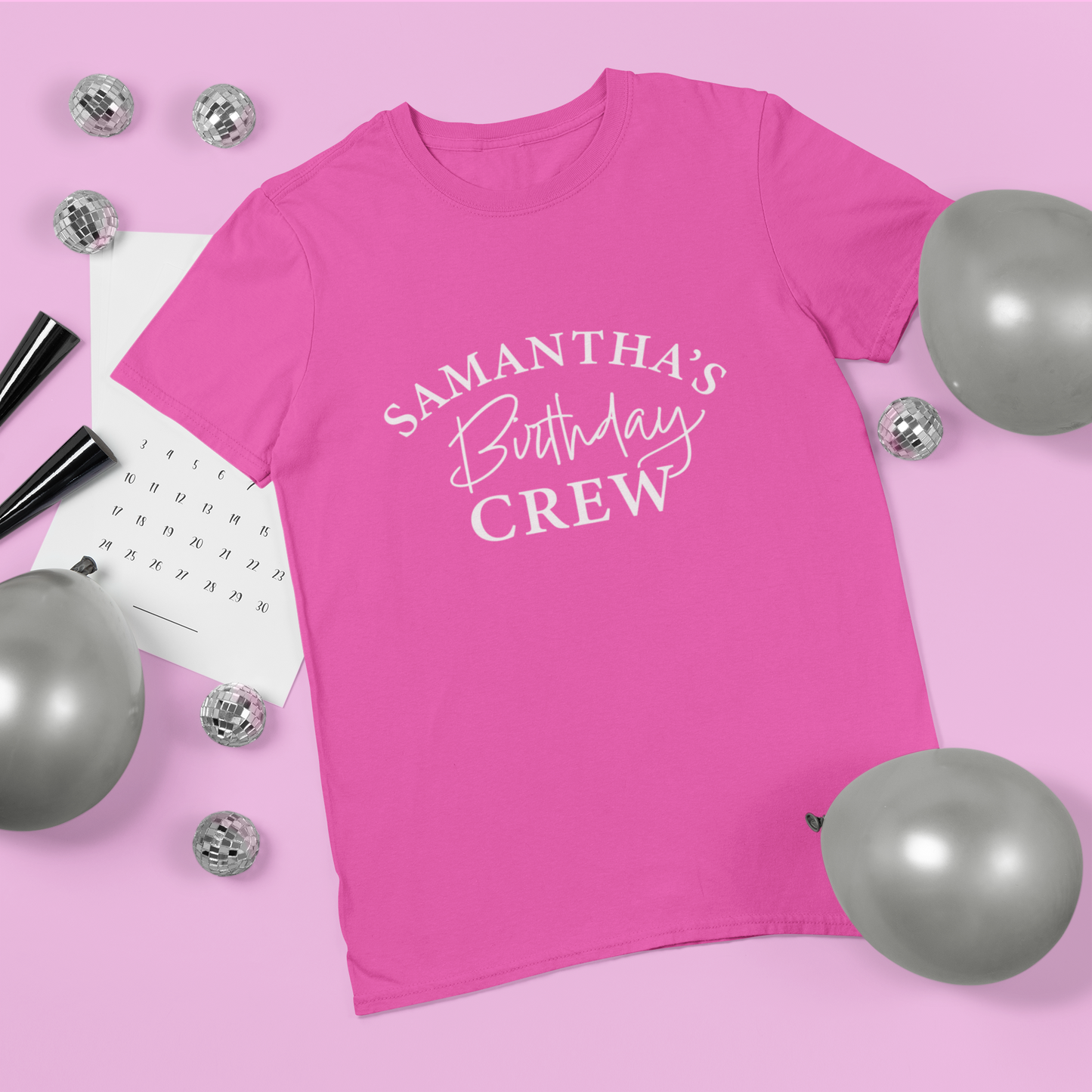 pink adults personalised tshirt with the words Samantha's birthday crew written on the front in white text.
