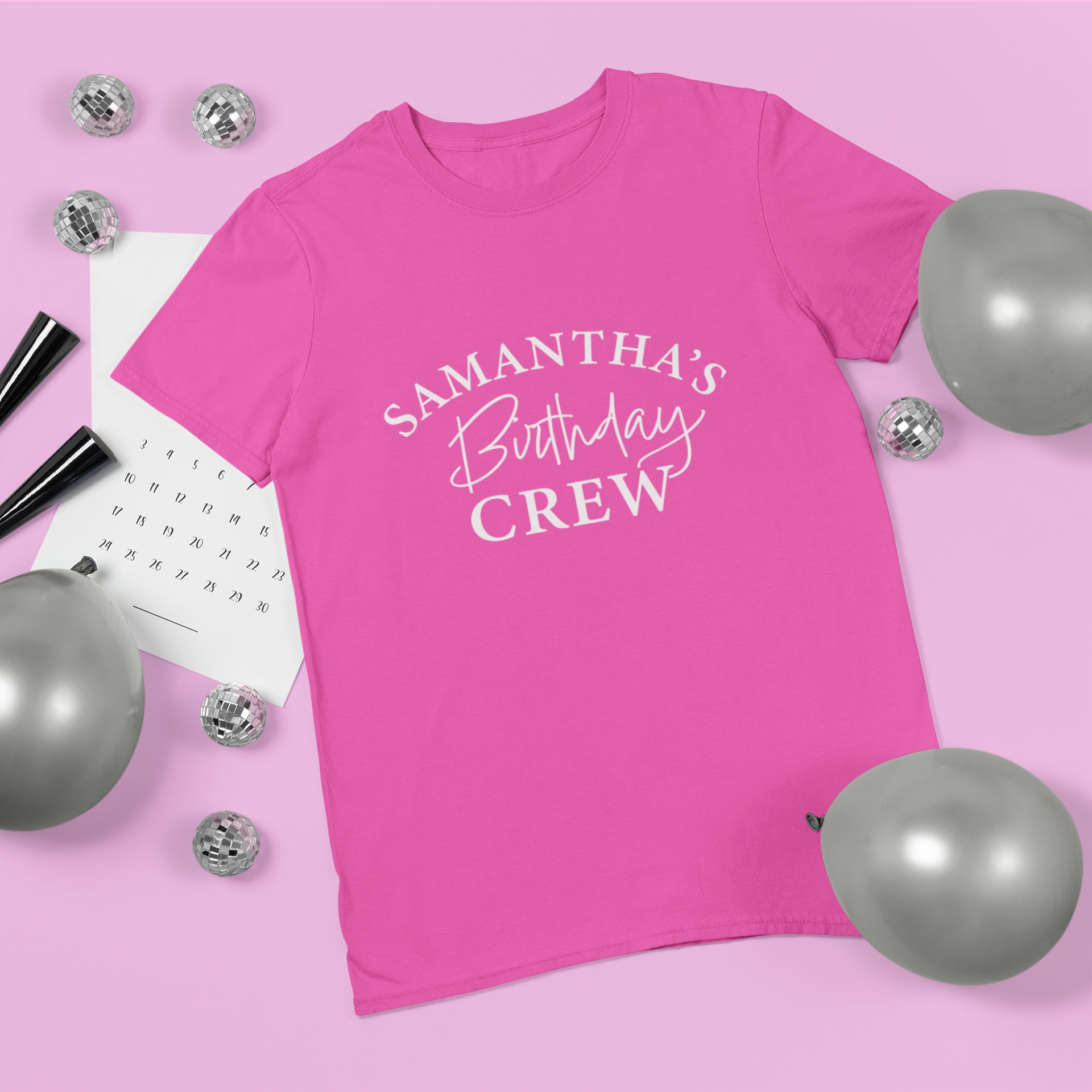 pink adults personalised tshirt with the words Samantha's birthday crew written on the front in white text.
