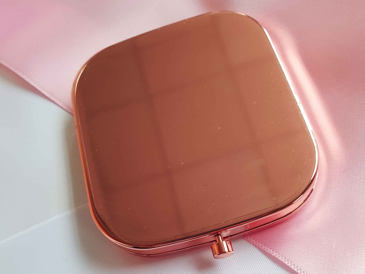 Image shows the back of the rose gold pocket mirror