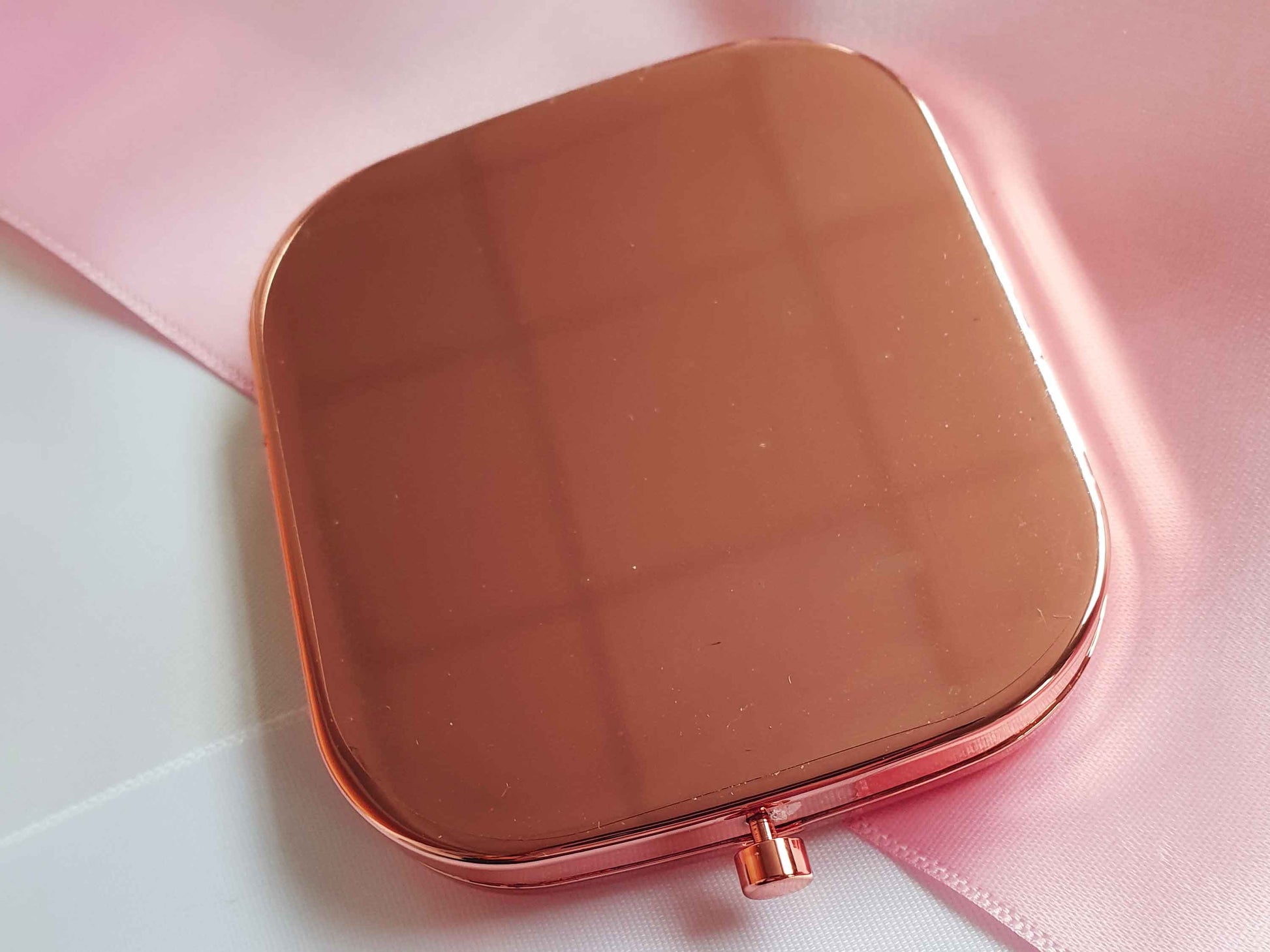 Image shows the back of the rose gold pocket mirror