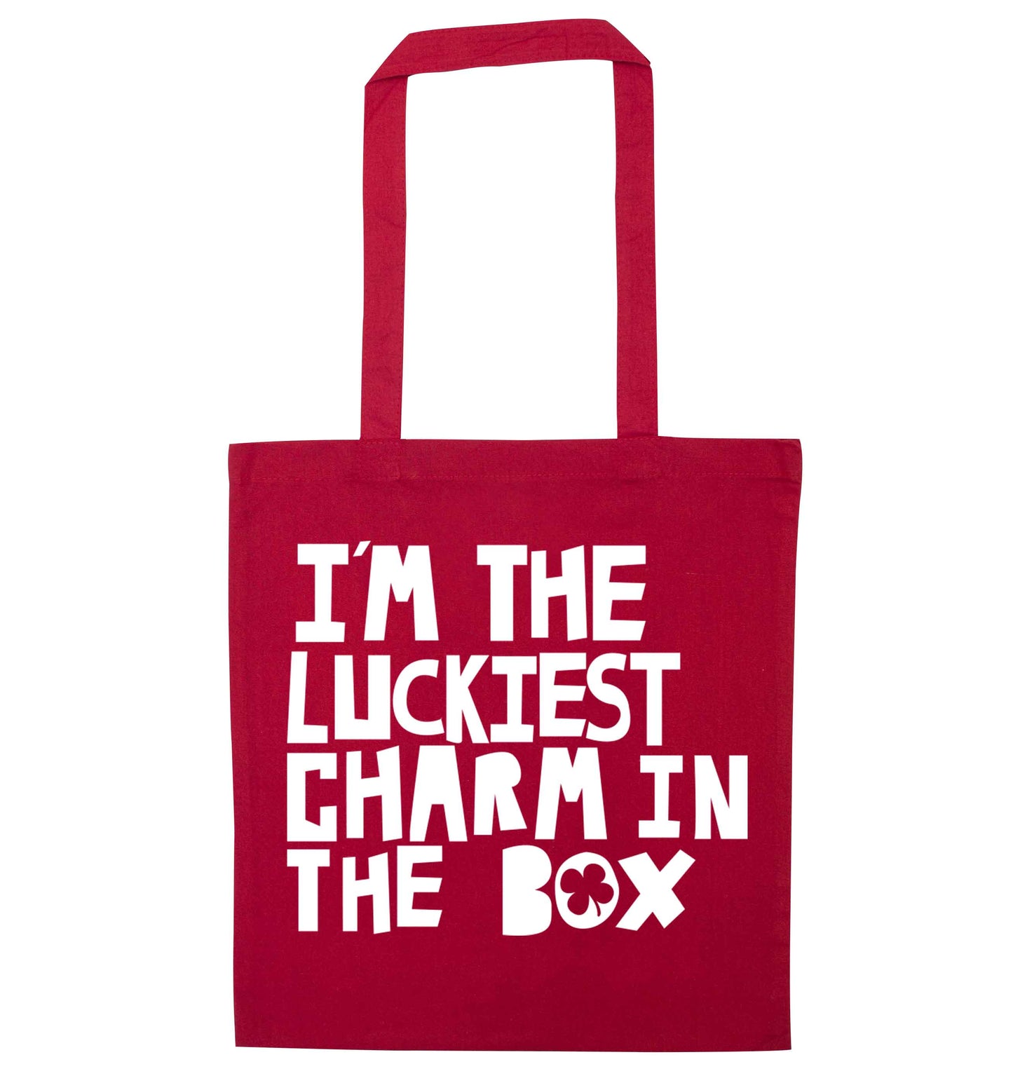 I'm the luckiest charm in the box red tote bag