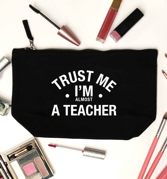 Trust me I'm almost a teacher black makeup bag