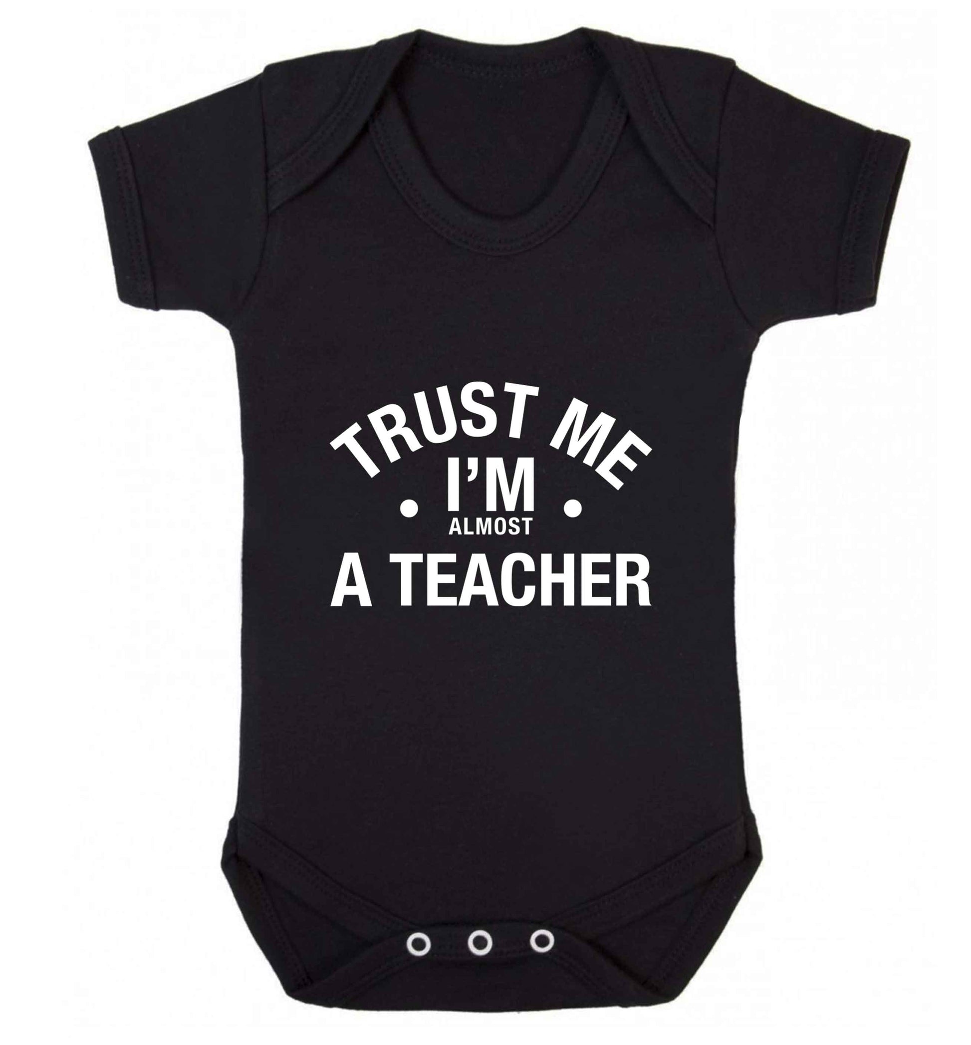 Trust me I'm almost a teacher baby vest black 18-24 months