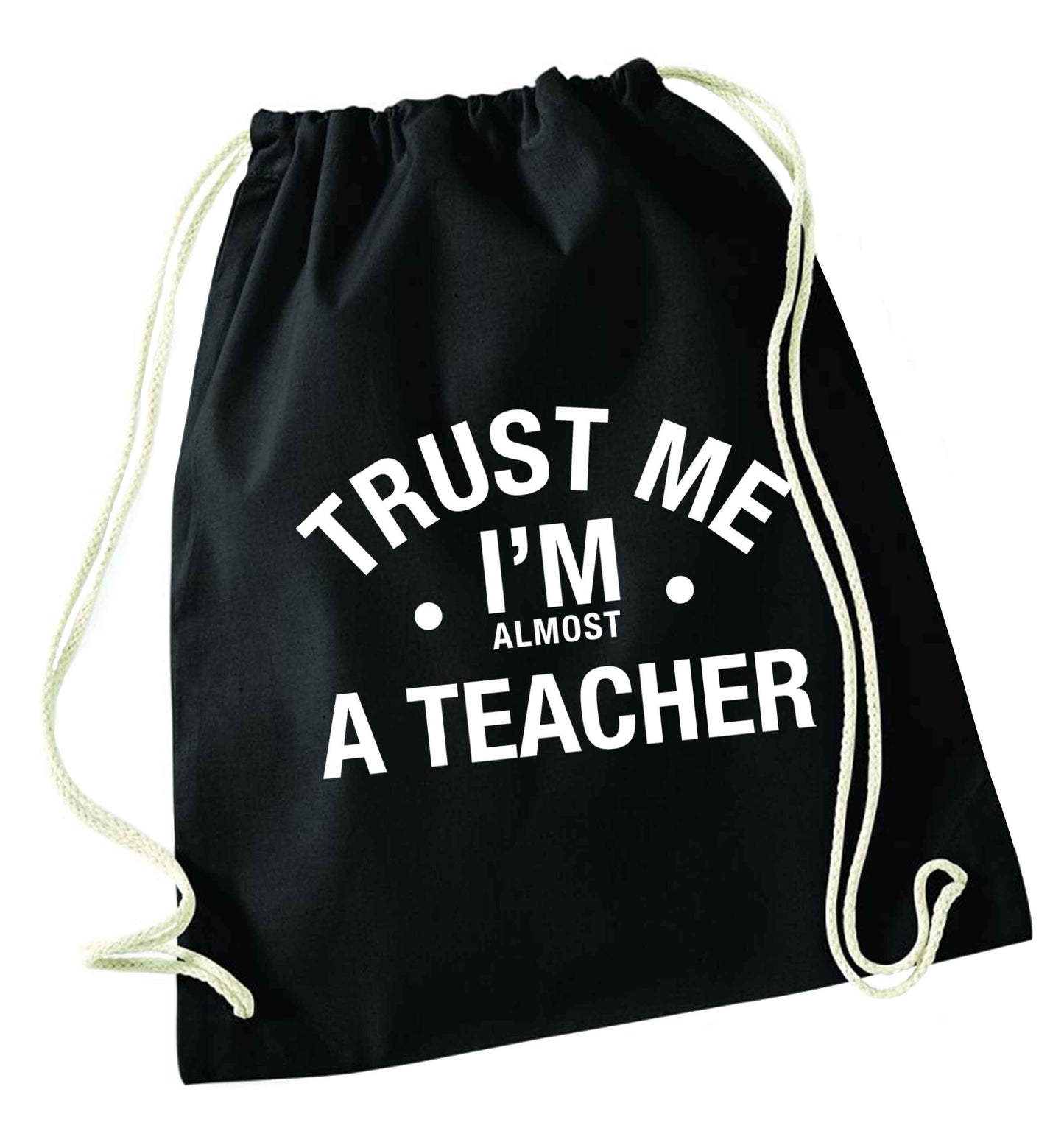 Trust me I'm almost a teacher black drawstring bag