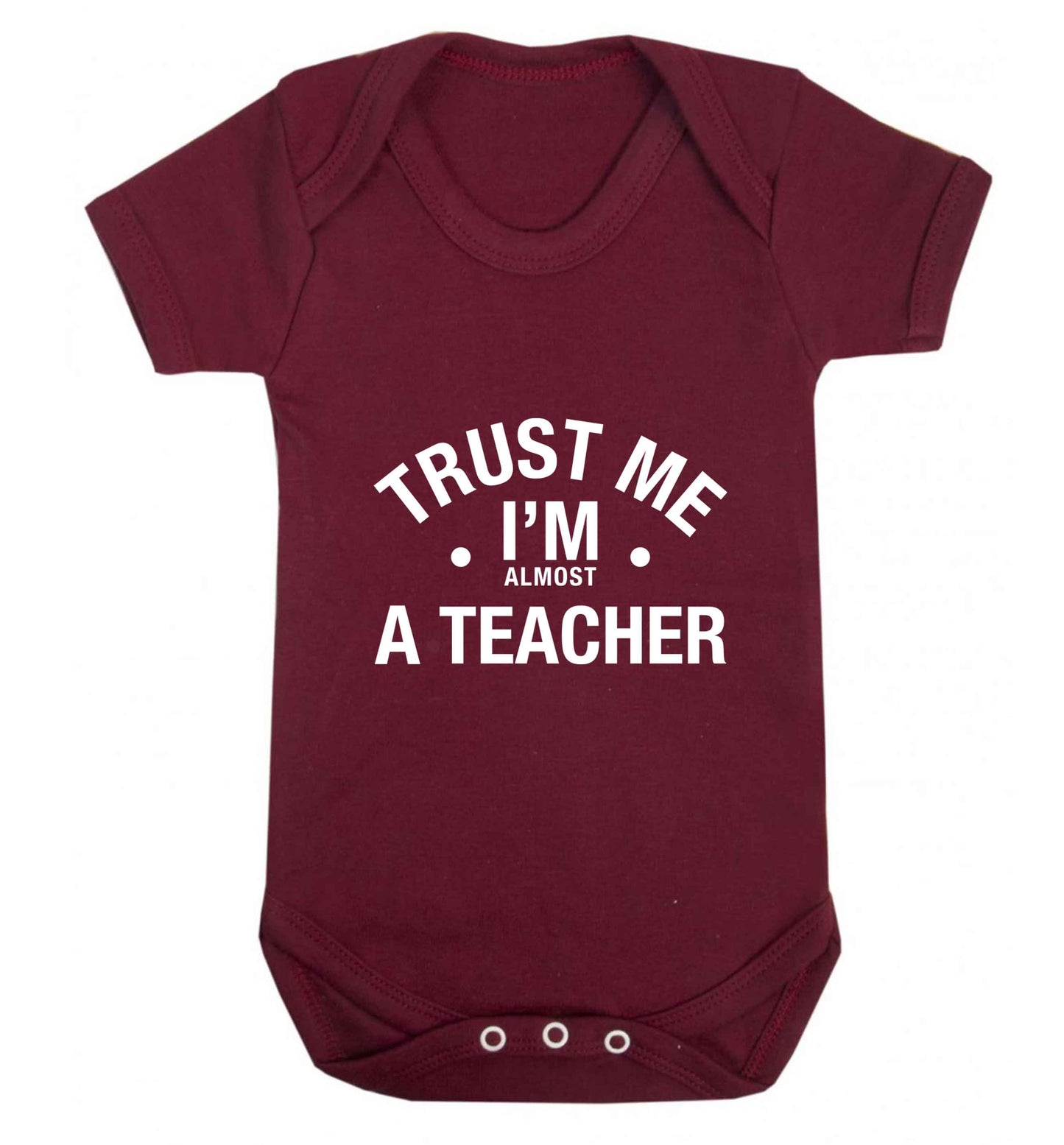 Trust me I'm almost a teacher baby vest maroon 18-24 months