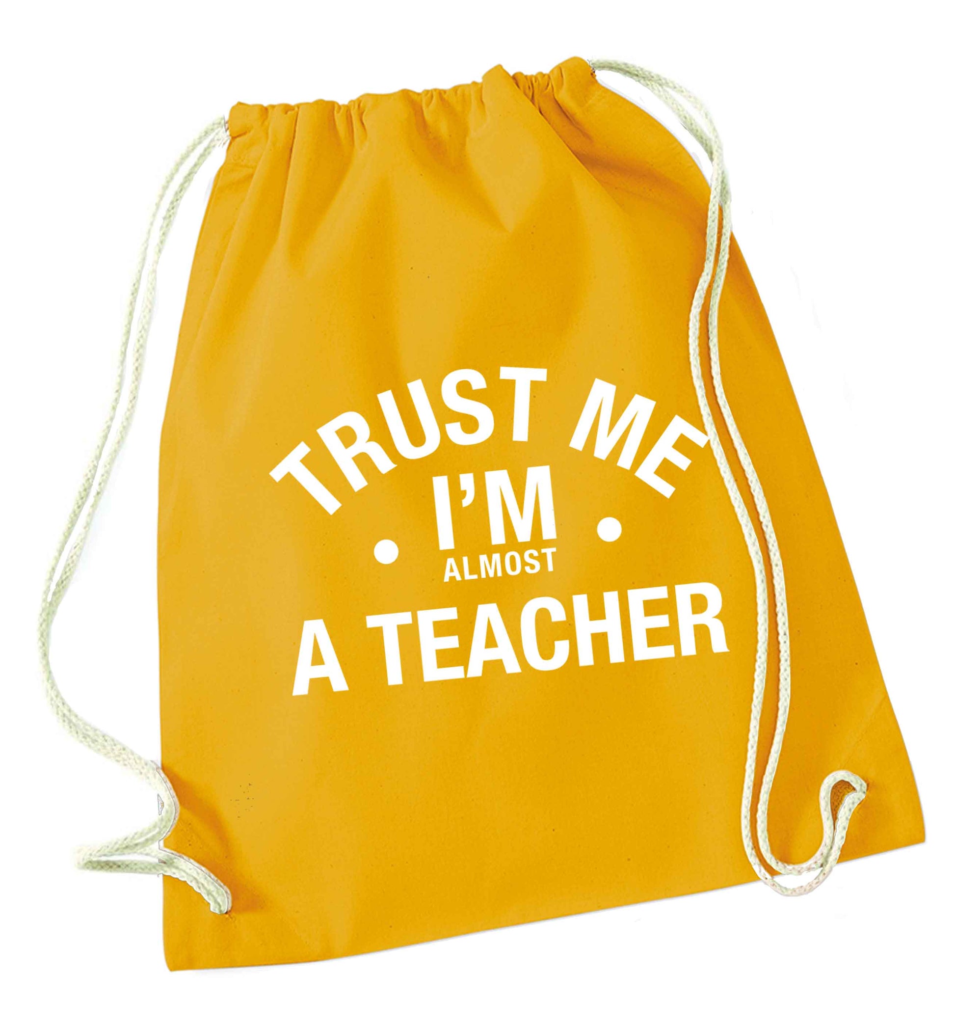 Trust me I'm almost a teacher mustard drawstring bag