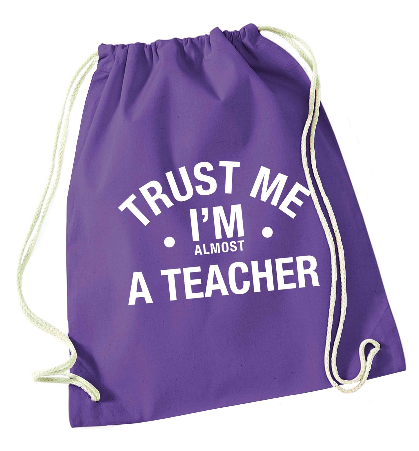 Trust me I'm almost a teacher purple drawstring bag