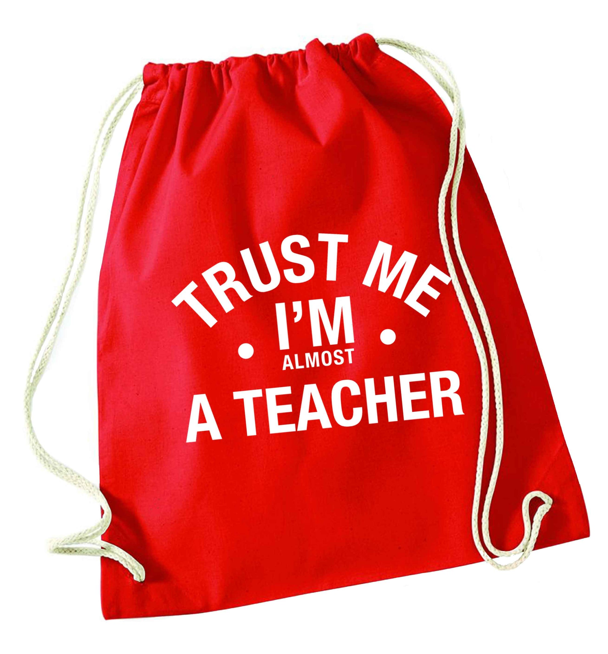 Trust me I'm almost a teacher red drawstring bag 