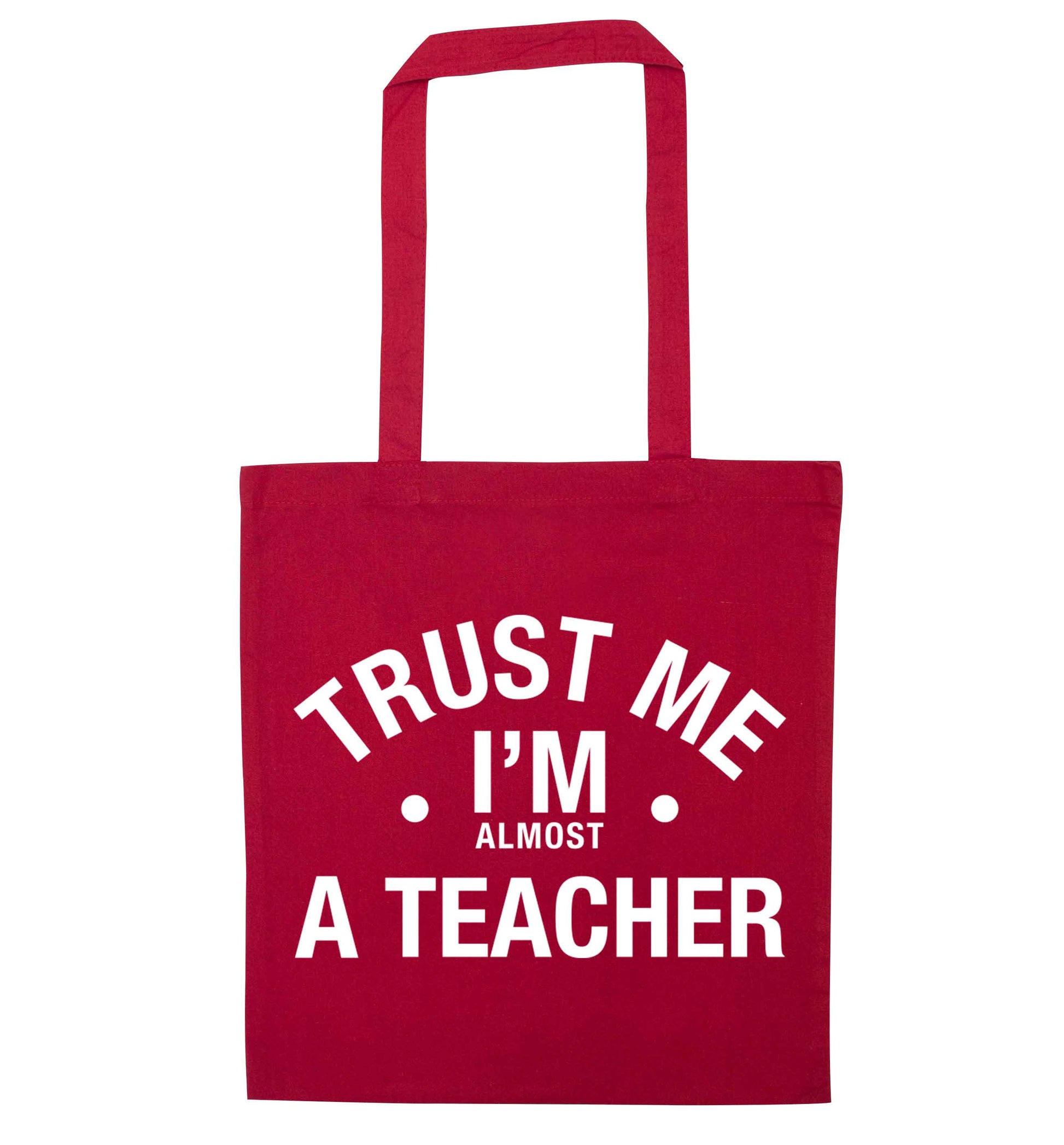 Trust me I'm almost a teacher red tote bag