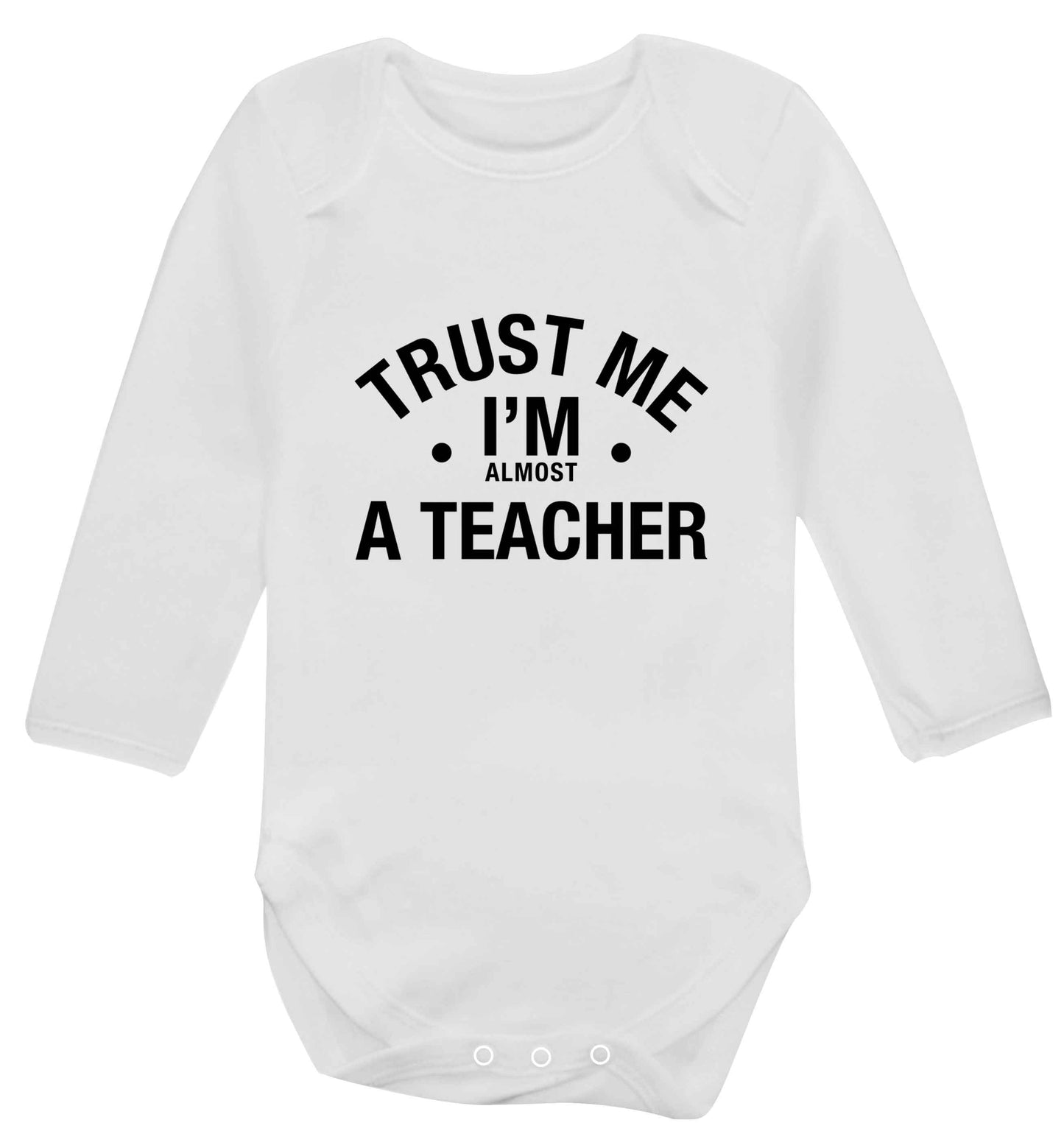 Trust me I'm almost a teacher baby vest long sleeved white 6-12 months