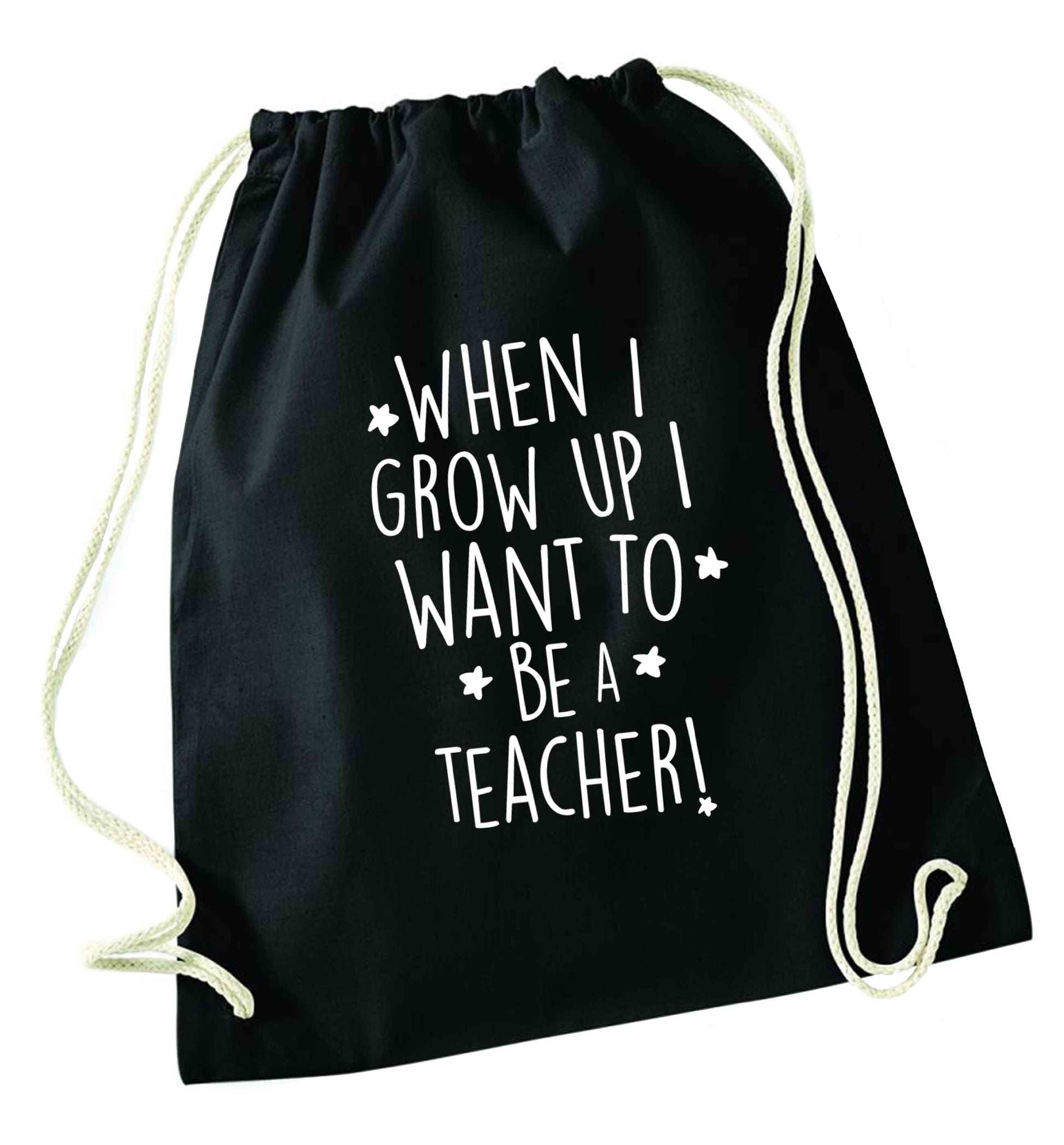 When I grow up I want to be a teacher black drawstring bag