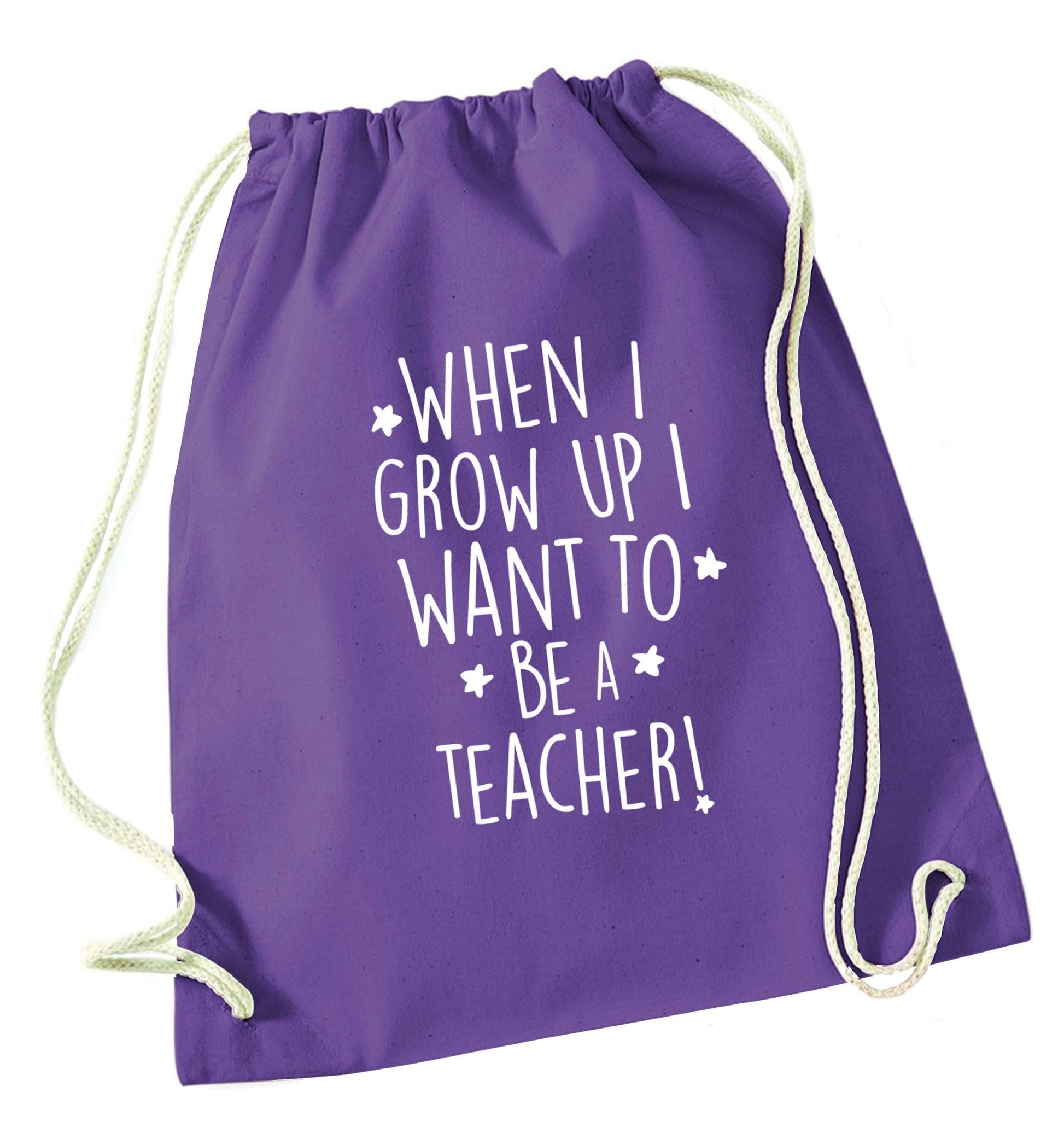 When I grow up I want to be a teacher purple drawstring bag