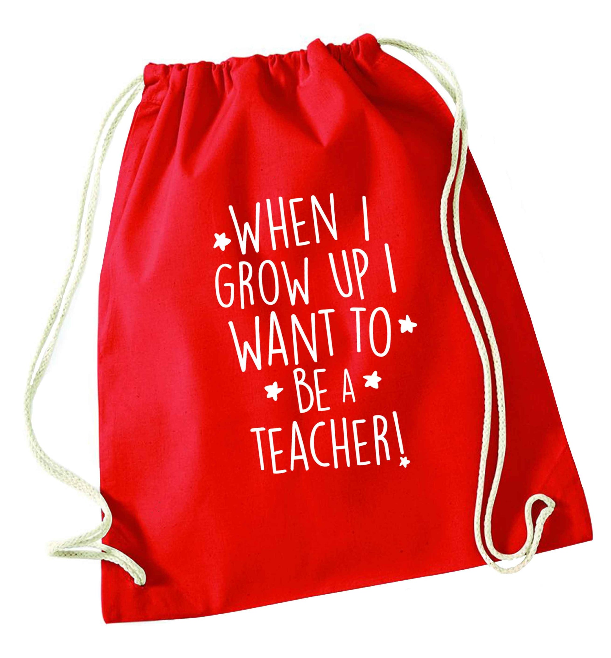 When I grow up I want to be a teacher red drawstring bag 