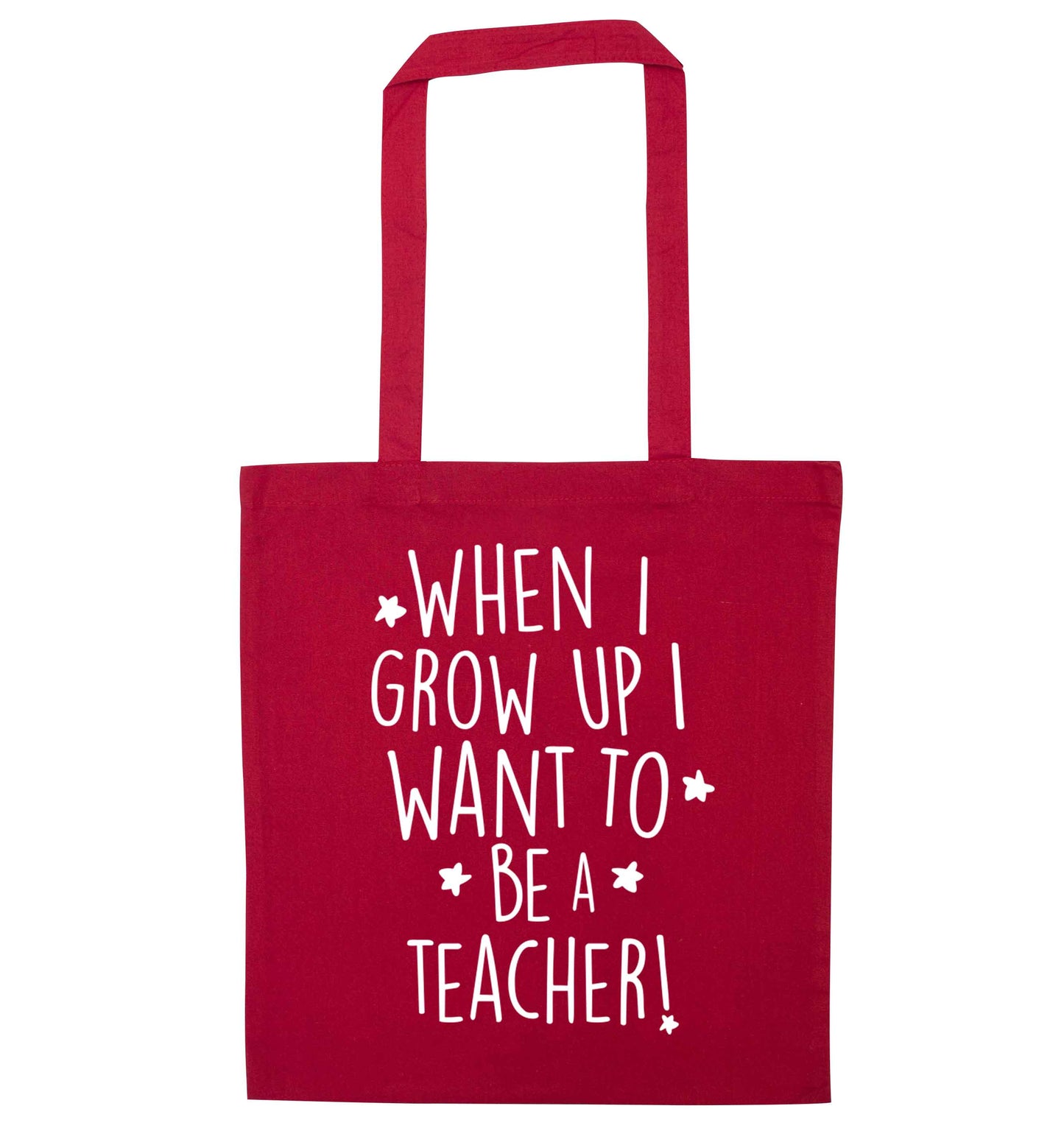 When I grow up I want to be a teacher red tote bag