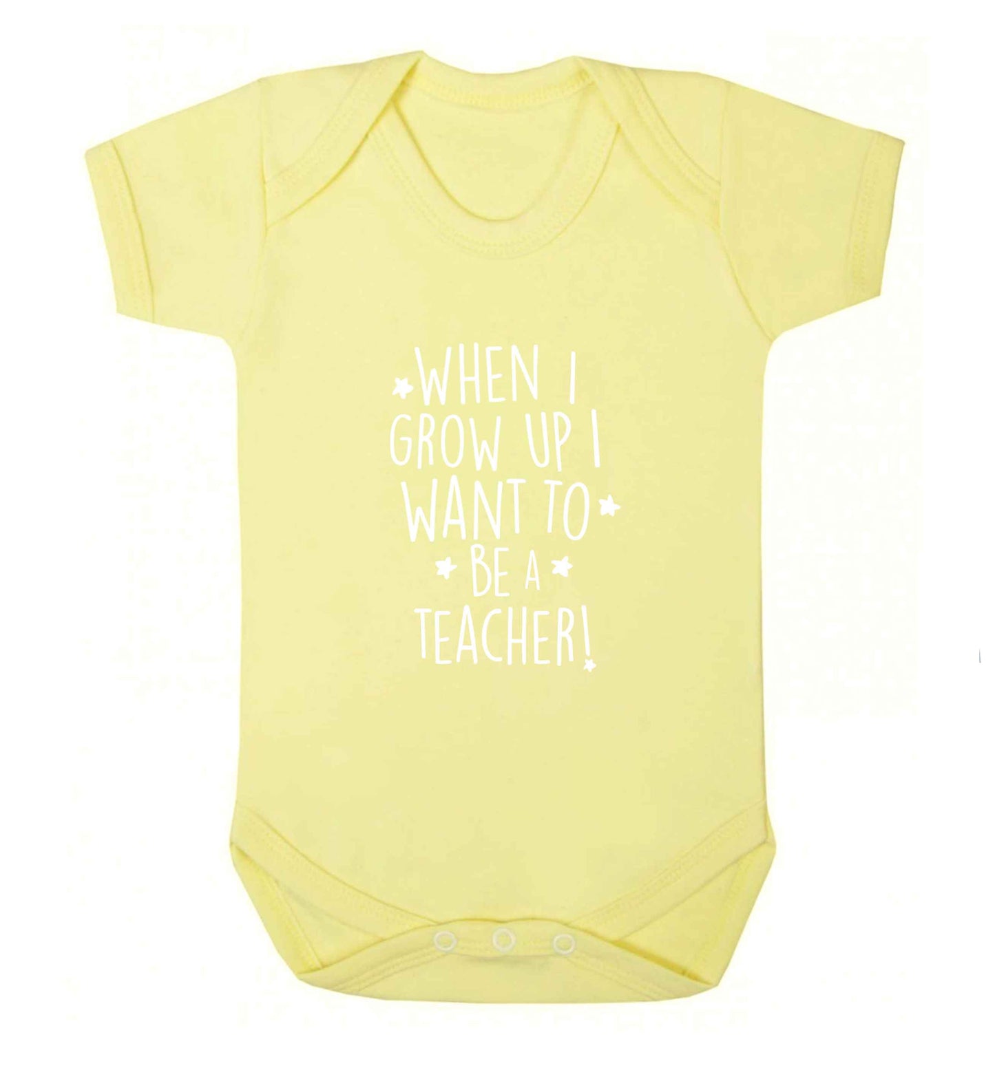 When I grow up I want to be a teacher baby vest pale yellow 18-24 months