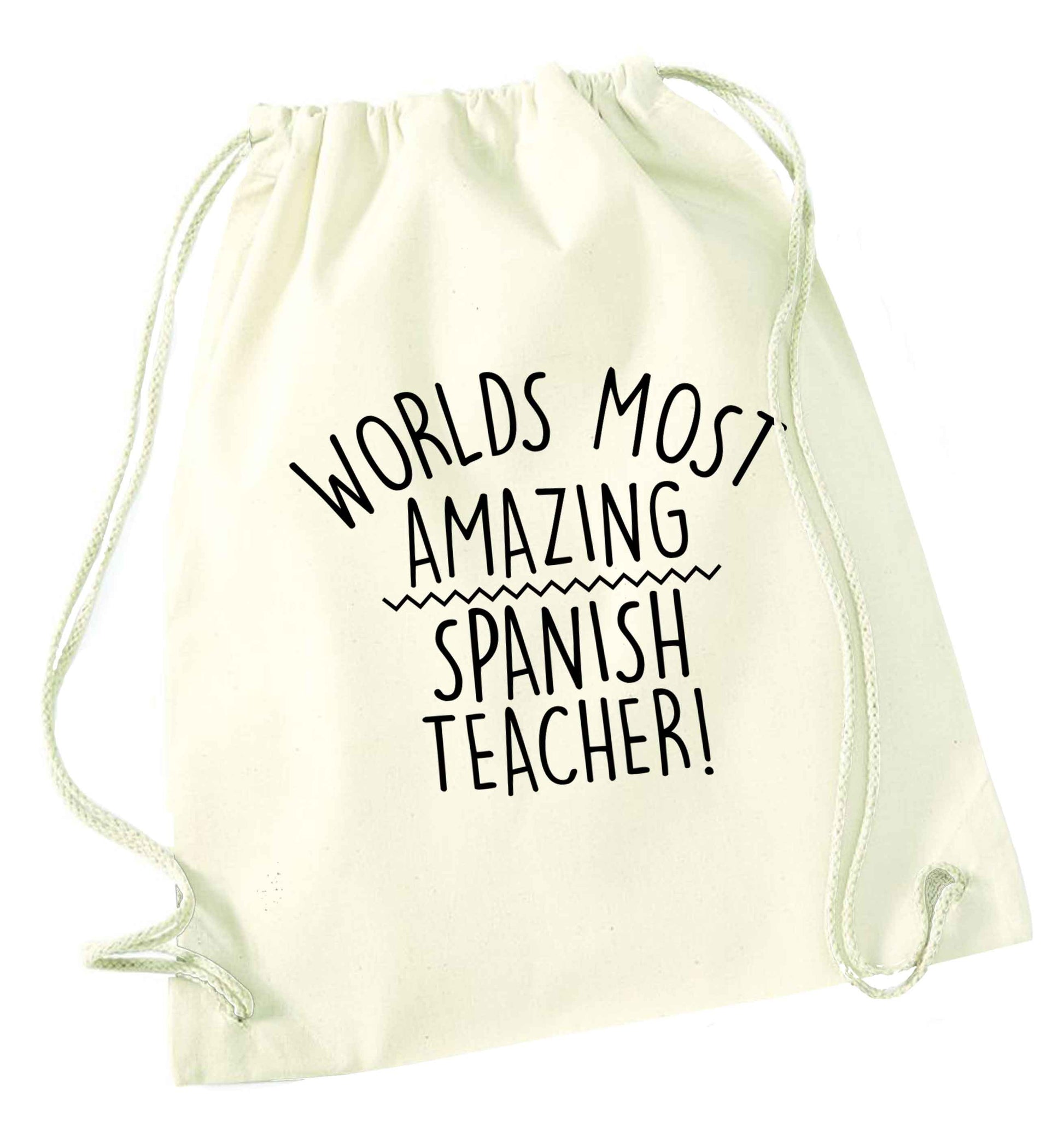 Worlds most amazing Spanish teacher natural drawstring bag