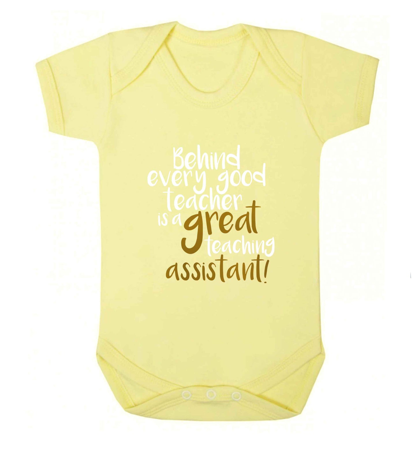 Behind every good teacher is a great teaching assistant baby vest pale yellow 18-24 months