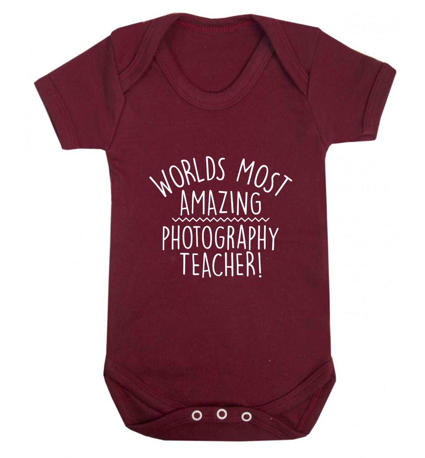 Worlds most amazing photography teacher baby vest maroon 18-24 months