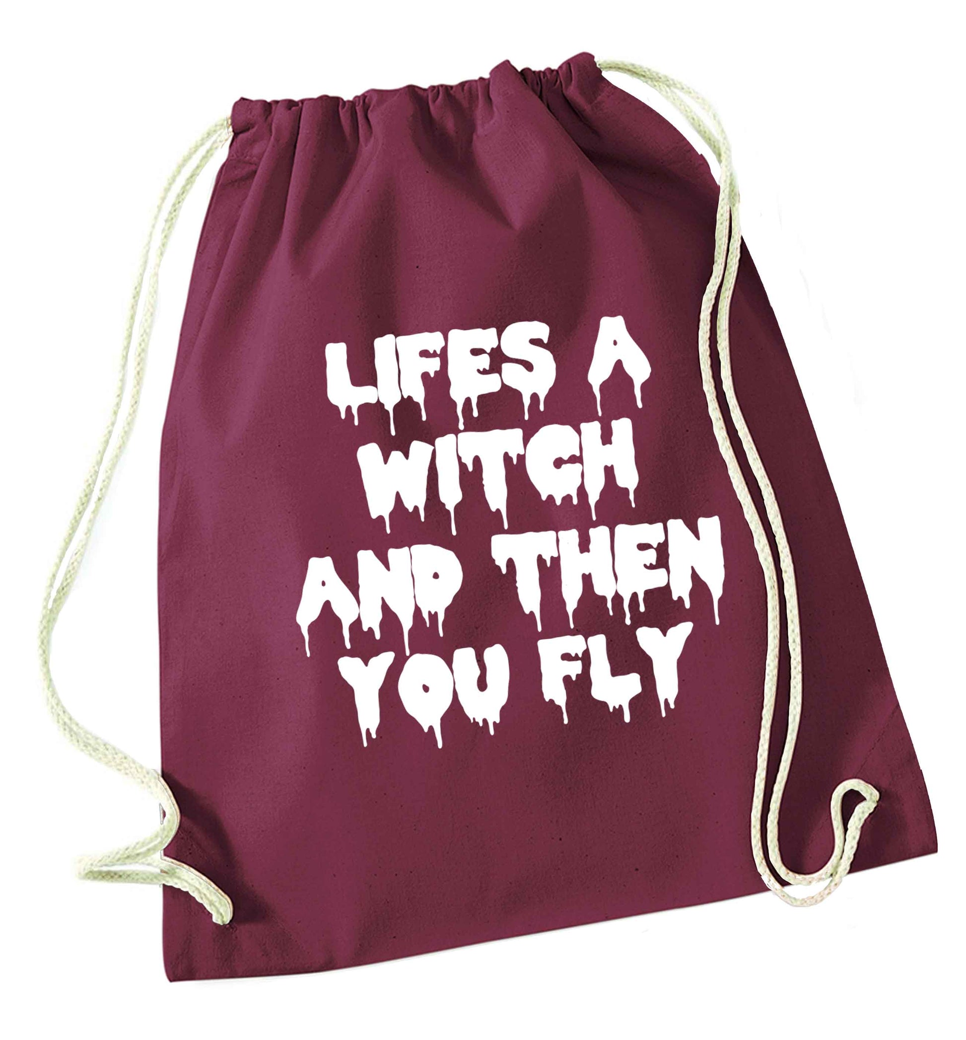 Life's a witch and then you fly maroon drawstring bag