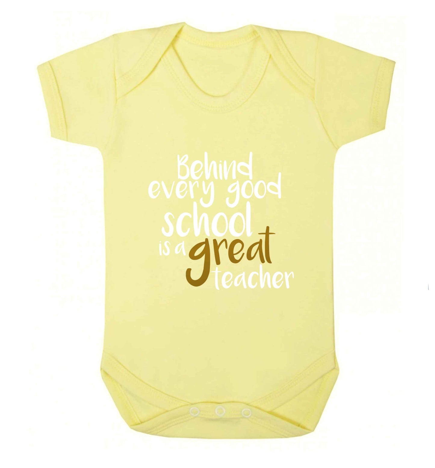 Behind every good school is a great teacher baby vest pale yellow 18-24 months