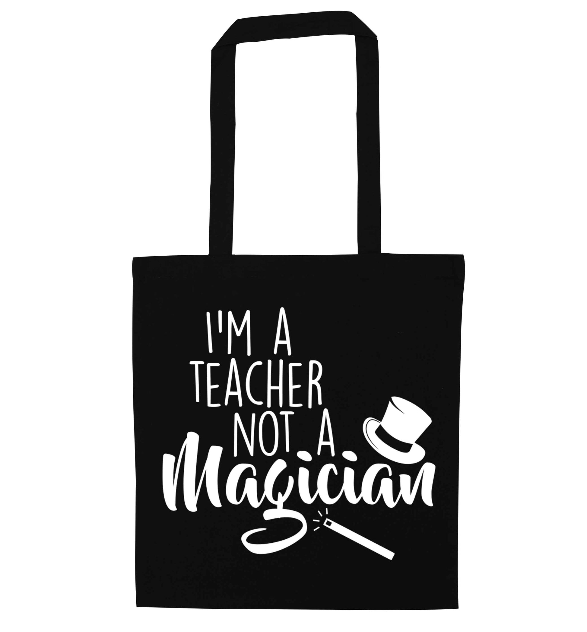I'm a teacher not a magician black tote bag