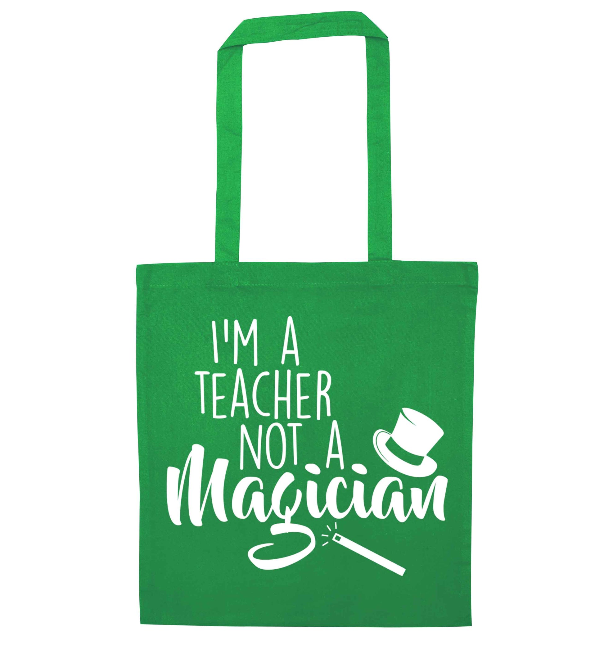 I'm a teacher not a magician green tote bag