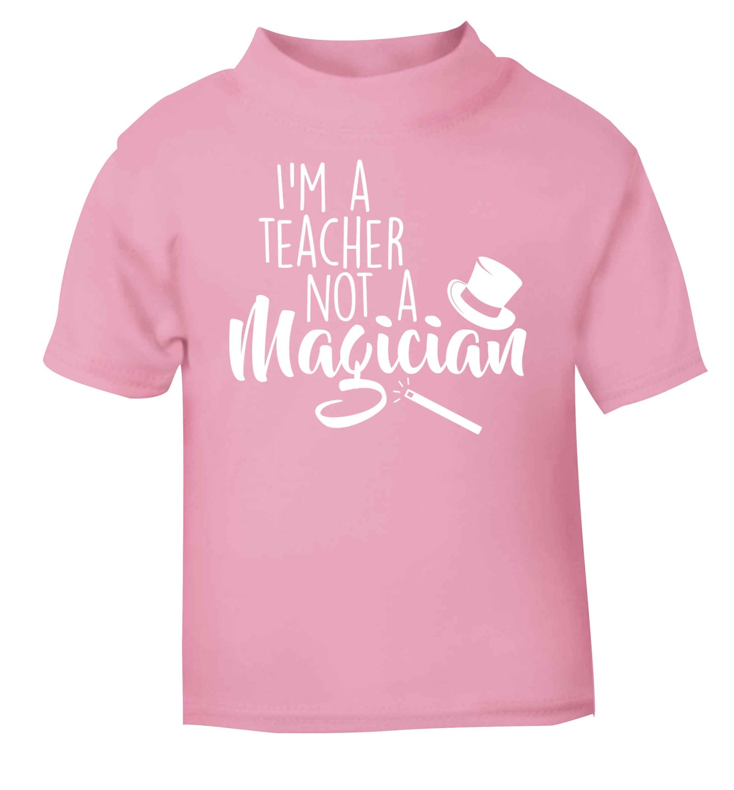 I'm a teacher not a magician light pink baby toddler Tshirt 2 Years