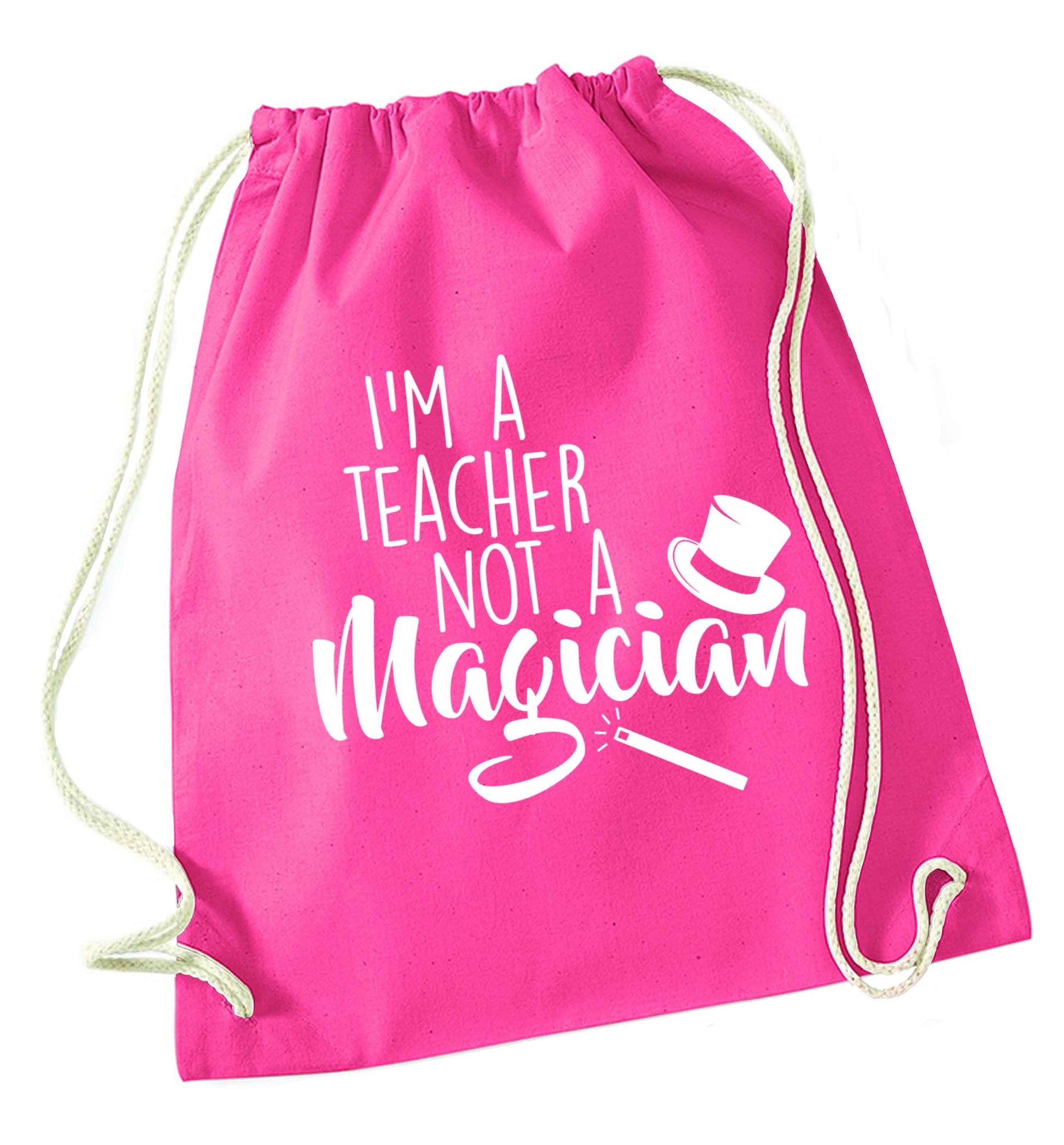 I'm a teacher not a magician pink drawstring bag