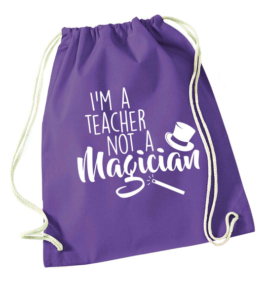 I'm a teacher not a magician purple drawstring bag