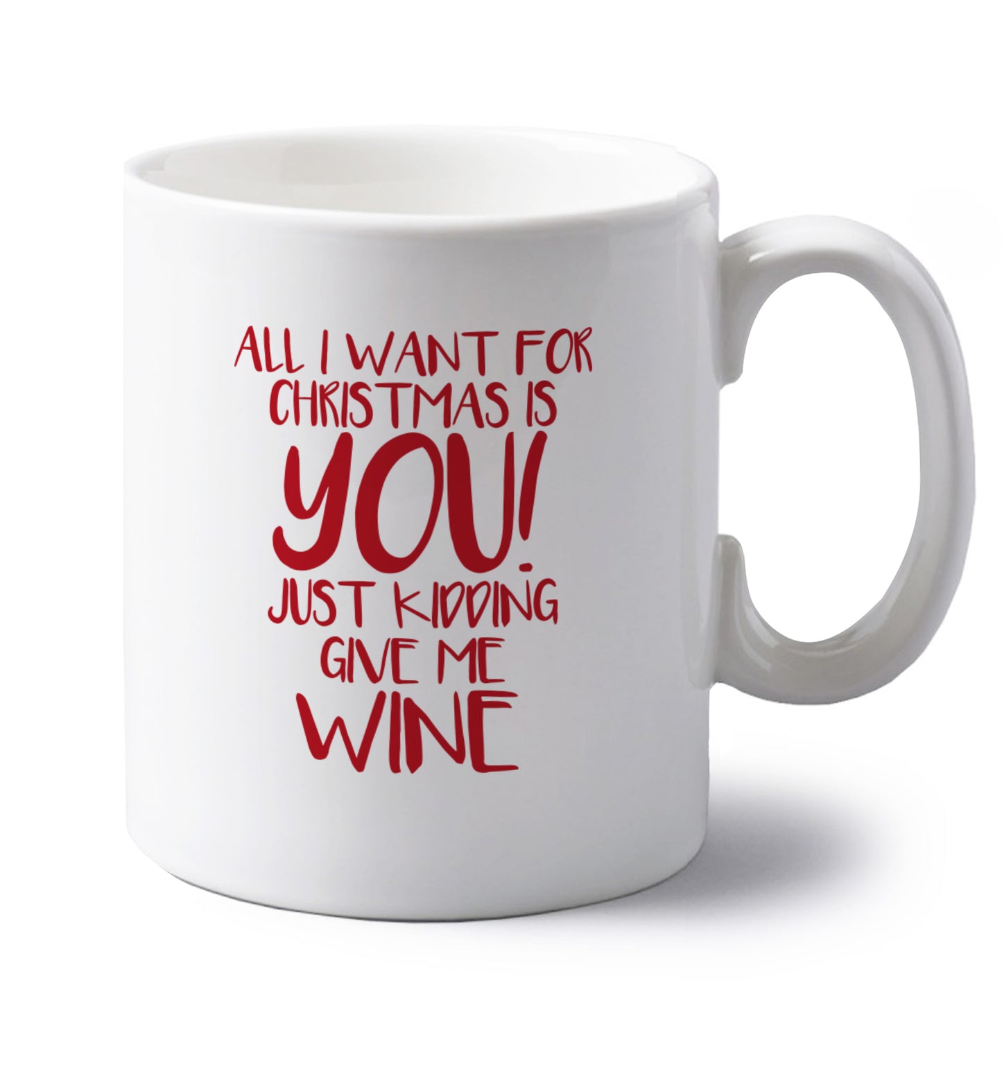 All I want for christmas is you just kidding give me the wine left handed white ceramic mug 