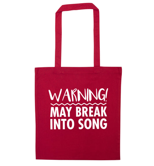 Warning may break into song red tote bag
