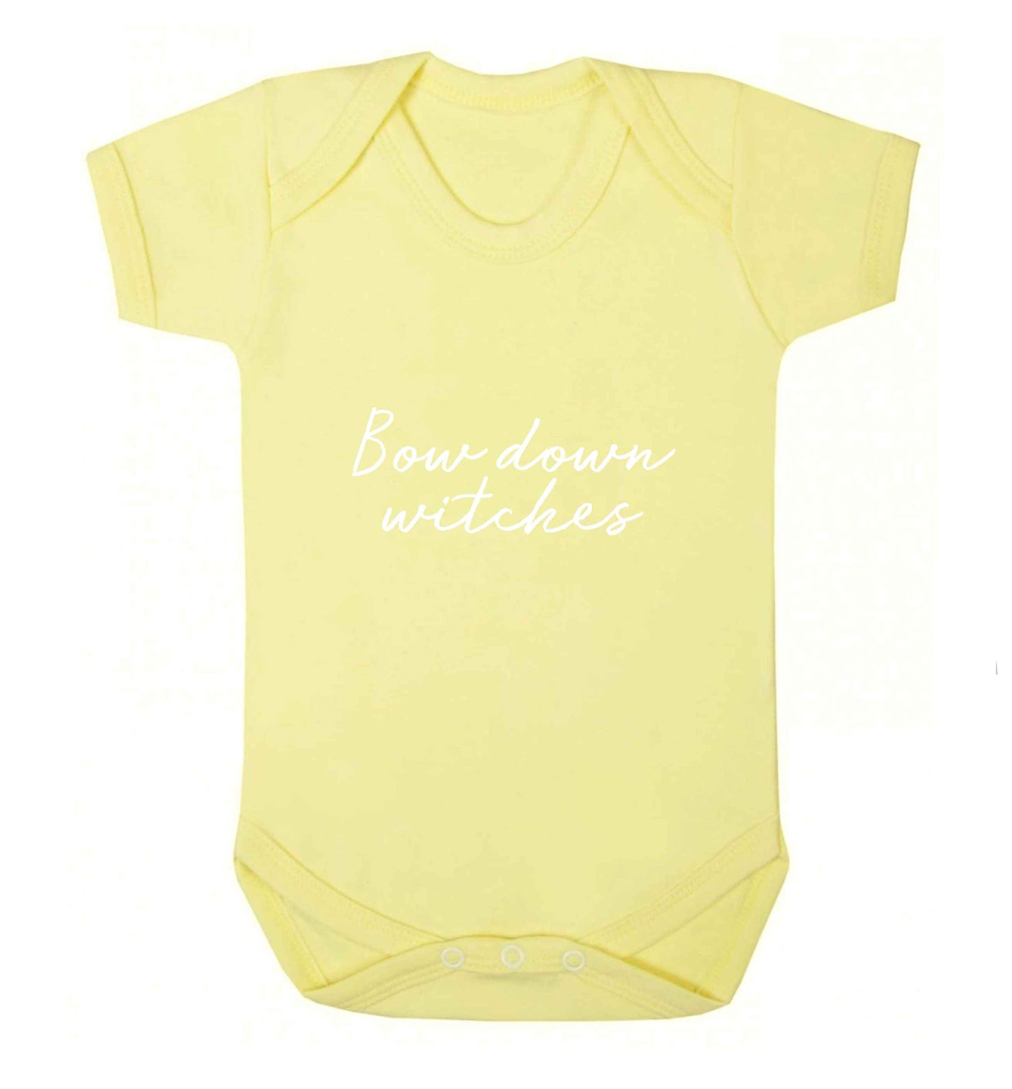 Bow down witches baby vest pale yellow 18-24 months