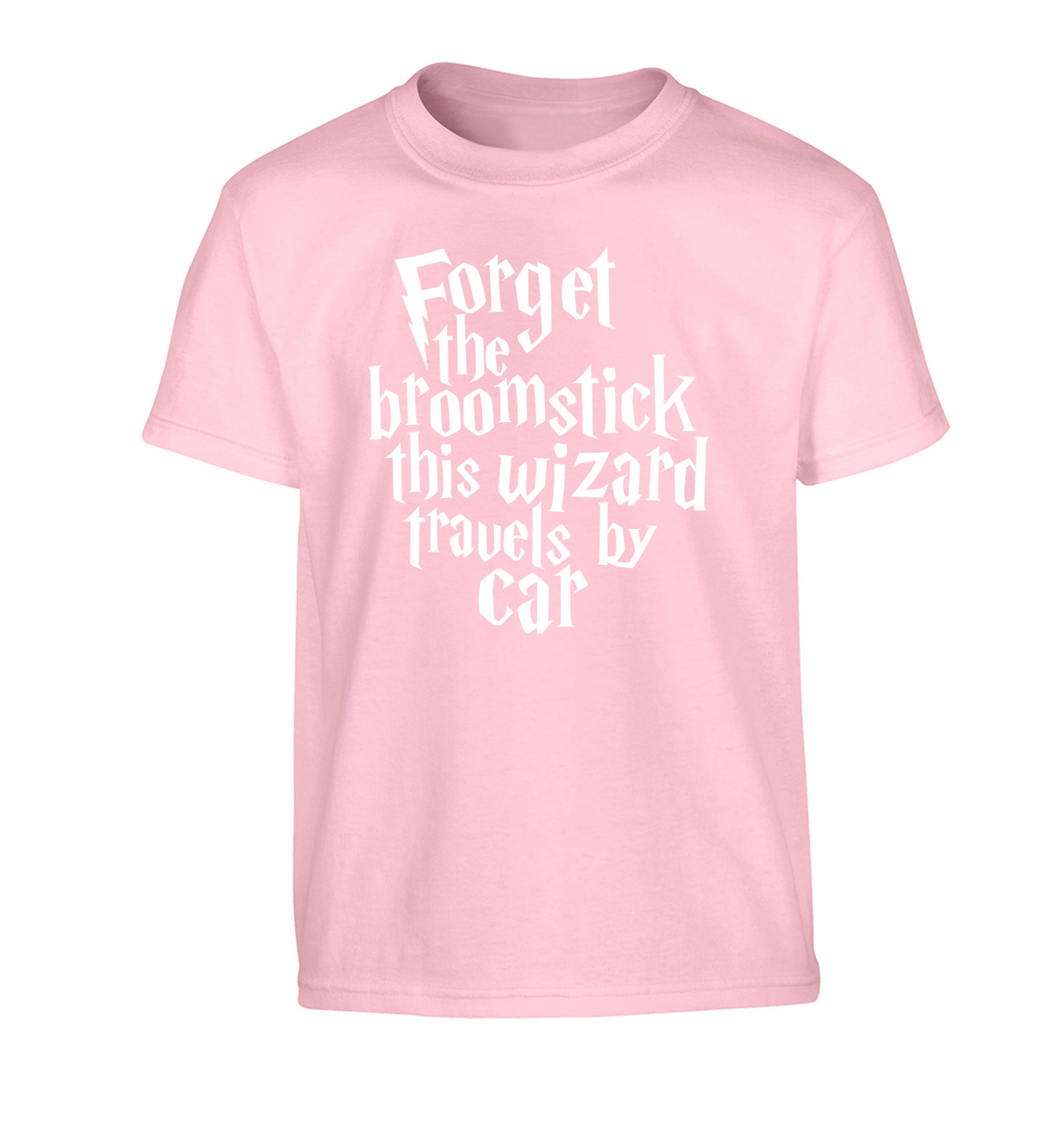 Forget the broomstick this wizard travels by car Children's light pink Tshirt 12-14 Years