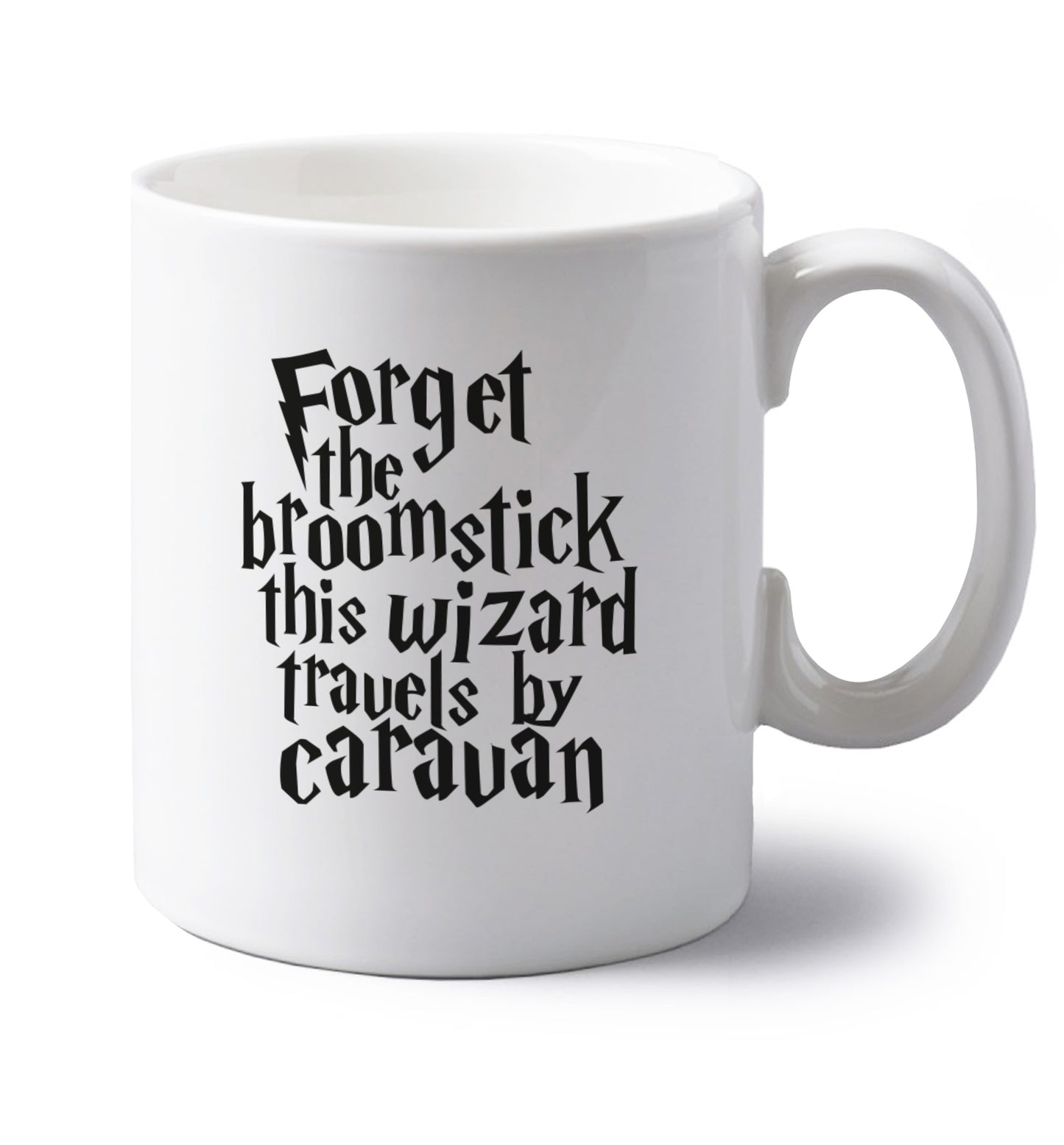 Forget the broomstick this wizard travels by caravan left handed white ceramic mug 