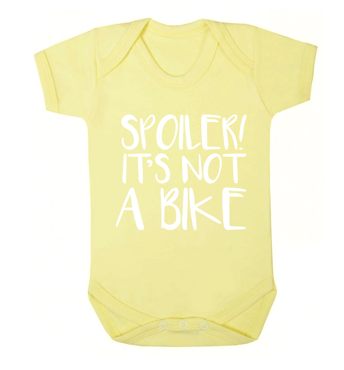 Spoiler it's not a bike Baby Vest pale yellow 18-24 months