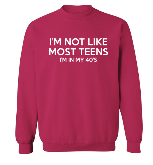 I'm not like most teens (I'm in my 40's) Adult's unisex pink Sweater 2XL