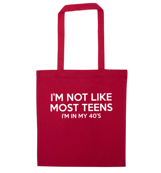 I'm not like most teens (I'm in my 40's) red tote bag