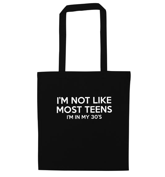 I'm not like most teens (I'm in my 30's) black tote bag